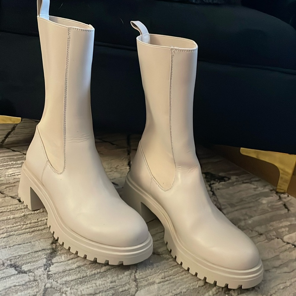 Cream colored water resistant Steve Madden boots.